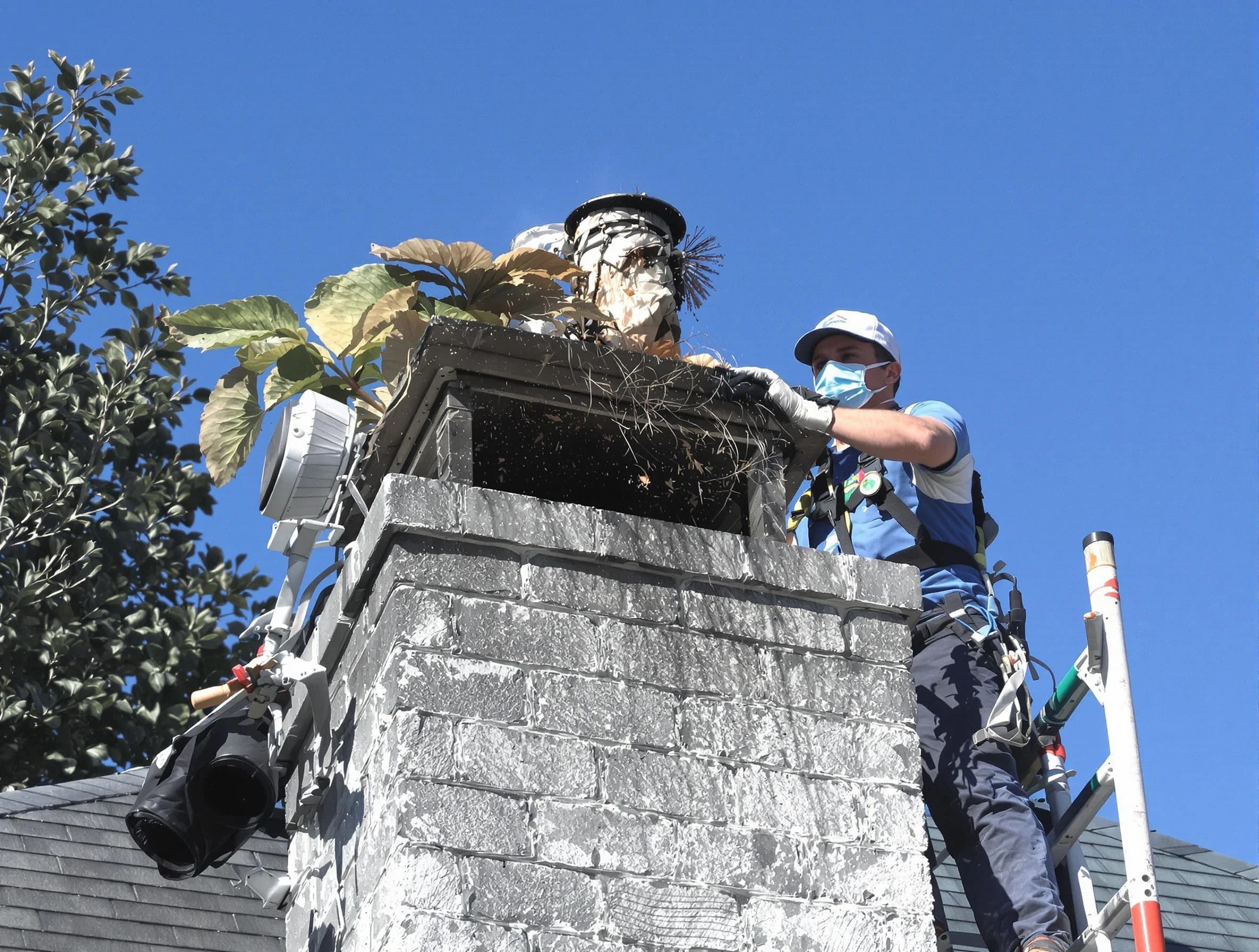 Little Egg Harbor Chimney Sweep specialist performing chimney cleaning in Little Egg Harbor, NJ